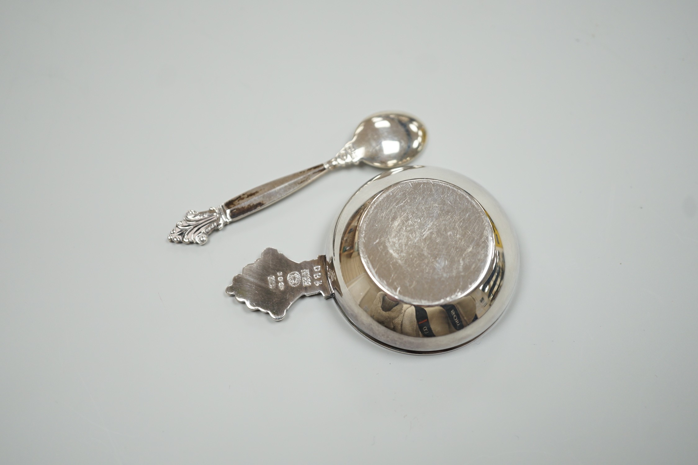 A modern Georg Jensen silver and enamel salt, design no. 180, 63mm and matching salt spoon, 64mm, gross weight 29.3 grams.